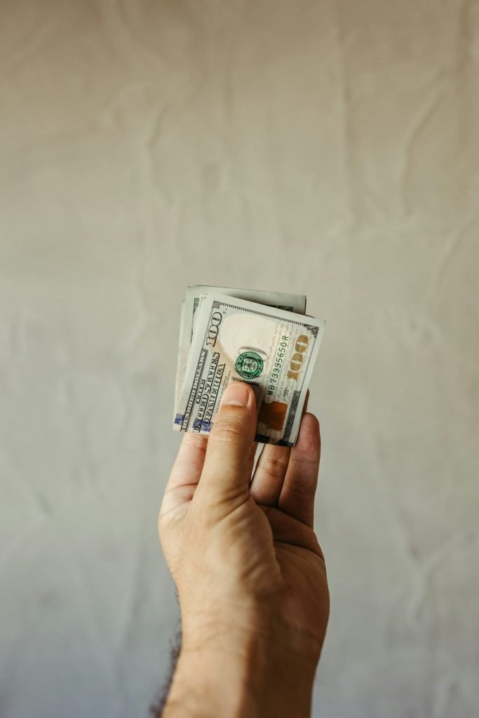 The Art of Drawing Readers In: Your attractive post title goes here a-person-holding-a-stack-of-money-in-their-hand-l8liqlphf20