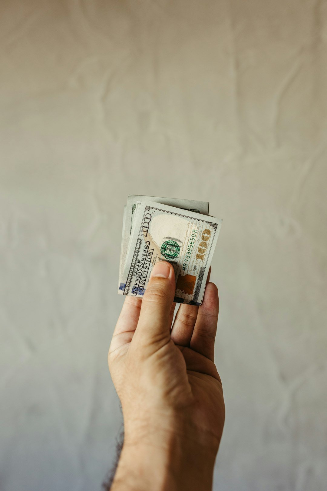 The Art of Drawing Readers In: Your attractive post title goes here a-person-holding-a-stack-of-money-in-their-hand-l8liqlphf20